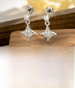 Detailed view of silver star cross earrings featuring white zircon inlay and 4mm round backs