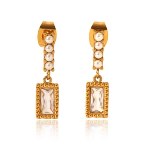Detail of gold earrings featuring four vertical pearls and a rectangular zircon drop