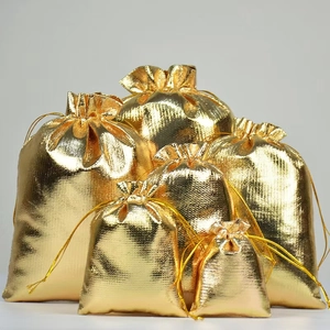 Five assorted sizes of golden metallic drawstring gift pouches for jewelry storage