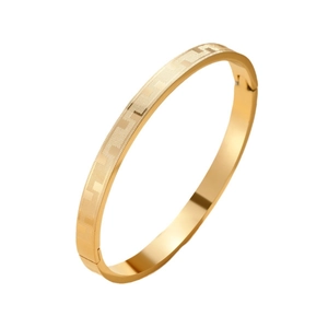Titanium steel bangle with geometric pattern in gold finish and snap buckle closure
