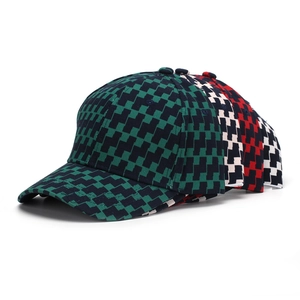 Detailed view of structured checkered baseball caps in four colorful plaid patterns