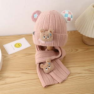 Detailed knit texture and cute bear patch on pink winter hat and scarf set for kids