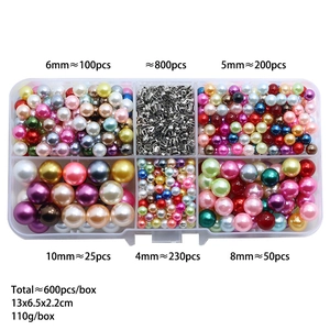 Assorted colorful DIY craft imitation pearls with sizes 4-10mm in a transparent grid box