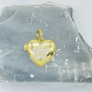 Gold heart photo locket necklace featuring a pave zircon star and polished finish