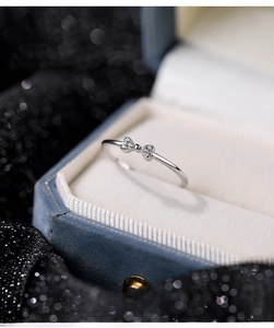 Close-up of S925 sterling silver bow ring with zircon pavé in a jewelry box