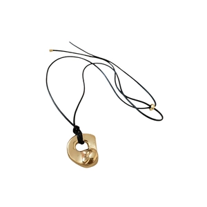 Hollow double heart gold pendant necklace with black cord chain in minimalist style