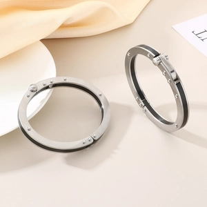 Minimalist stainless steel rivet bangle set with silver finish and black accent strips