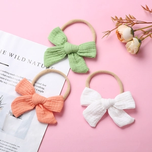 3-pack muslin cotton bow headbands for babies with soft nylon bands in green orange white