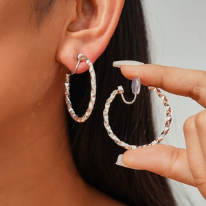 Silver geometric twisted hoop clip-on earrings with textured pattern for non-pierced ears
