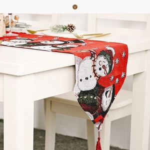 Red Christmas table runner with snowman embroidery and festive tassels for holiday decor