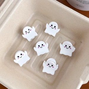 Detailed set of six cute ghost hair clips with cartoon faces on eco-friendly paper