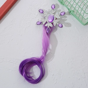 Detailed view of silver snowflake hair clip with purple gemstones and curly wig attachment