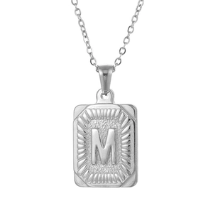 Minimalist stainless steel rectangular pendant necklace featuring engraved letter M