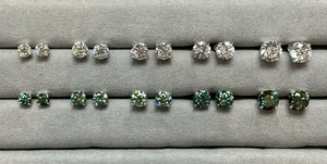 Detailed comparison of various moissanite stud earring sizes in classic silver settings