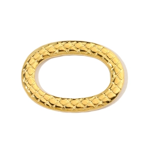 Macro shot of oval golden stainless steel pendant featuring distinct diamond lattice texture