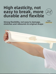 Detail of high elasticity white latex gloves showing strong stretching and tear resistance