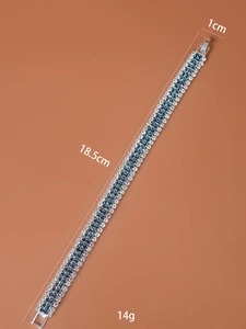 Detailed view of silver bracelet with blue rhinestones showing 18.5cm length and 1cm width