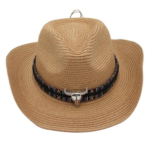 Detail of western straw cowboy hat with ethnic embroidery and silver bull head ornament