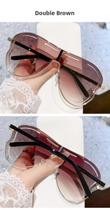 Détails des verres dégradés Double Brown et de la monture ajourée en métal des lunettes