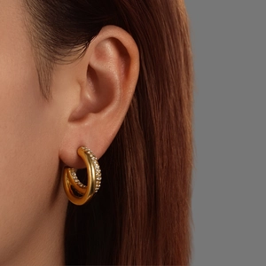 Elegant 18K gold plated C-shaped twist hoop earrings with pavé crystals for women