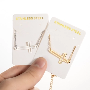 Minimalist stainless steel cross pendant necklace available in gold and silver finish