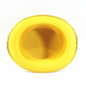 Interior view of a yellow performance top hat with glittery gold rim
