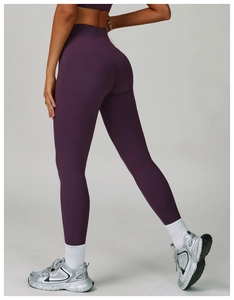 Detailed view of high-waisted deep purple yoga pants with body-sculpting fitness design