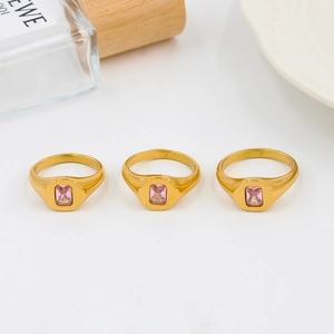 Three gold-plated stainless steel rings featuring emerald-cut pink zirconia stones