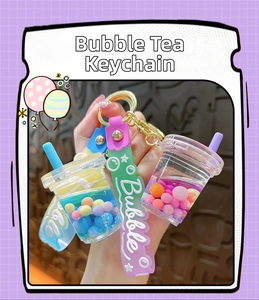 Detail of creative bubble tea cup keychains with liquid quicksand and colorful beads