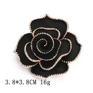 Vintage black rose brooch with gold beaded edges and camellia design, 3.8cm diameter