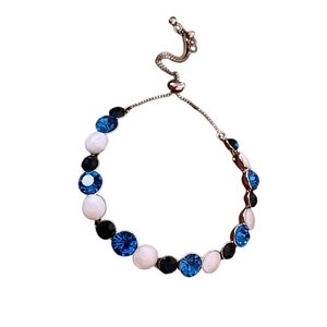 Adjustable silver bracelet with blue white and black inlaid stones in vintage style