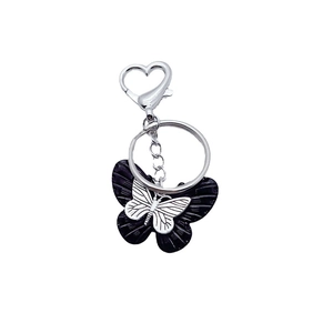 Retro black and silver resin butterfly keychain with heart clasp and ring on white base