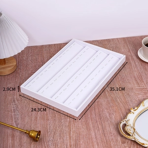 Detailed view of white jewelry display tray with dimensions 35.1cm x 24.3cm x 2.9cm