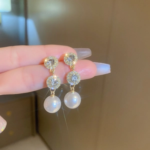 Elegant gold drop earrings with white pearls and sparkling rhinestones for women