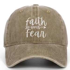 Close-up of Faith Over Fear embroidery on a vintage washed cotton baseball cap