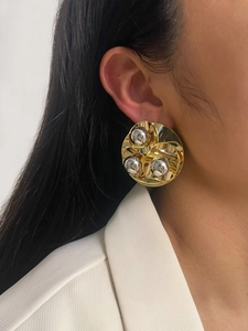 Side view of oversized retro gold-plated semi-circle earrings with silver spherical studs