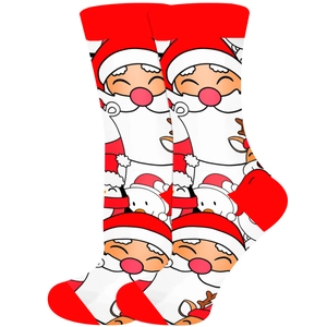 Vue détaillée de chaussettes de Noël rouges et blanches avec motifs Père Noël et renne