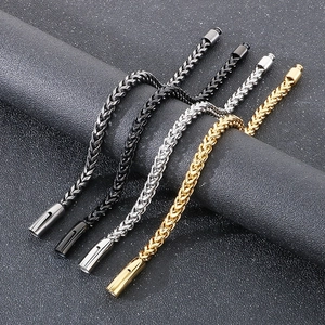 Vintage stainless steel foxtail chain bracelets in four colors on a display stand