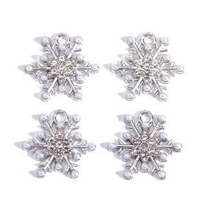 Detailed view of silver snowflake pendants with faux pearls and sparkling rhinestones