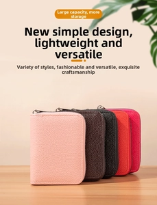 Litchi pattern PU leather zip card holders in multiple colors on a wooden surface
