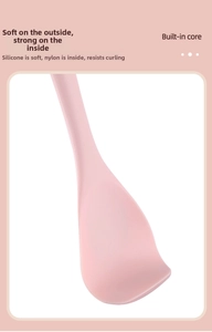 Detail of pink silicone spatula showing flexible edge and durable nylon inner core