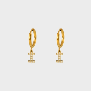 Detail showing gold-plated hoop earrings with sparkling cubic zirconia letter I pendants