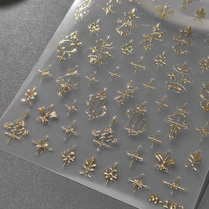 3D gold embossed nail stickers M-162 featuring star and leaf patterns on transparent film