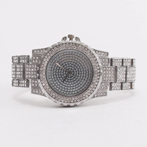Luxurious silver quartz watch for women fully iced out with sparkling crystals in white studio