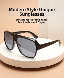 Flat top oversized rimless sunglasses in black displayed on a white tray minimalist style