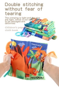 Macro detail of tear-resistant baby cloth book with double stitching and dinosaur theme