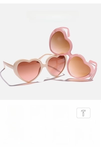 Detail of beige and pink heart sunglasses showing UV400 protection and polarized lenses