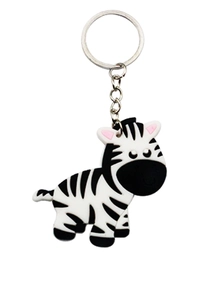 Macro detail of cartoon zebra PVC keychain with classic black and white stripes and silver ring