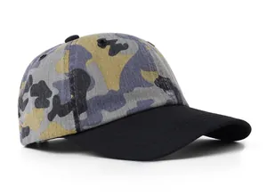 Side view of camo baseball cap with washed vintage texture and black reinforced brim
