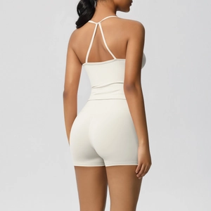Rear view of cream yoga set showing strapless open back top and high waist shorts